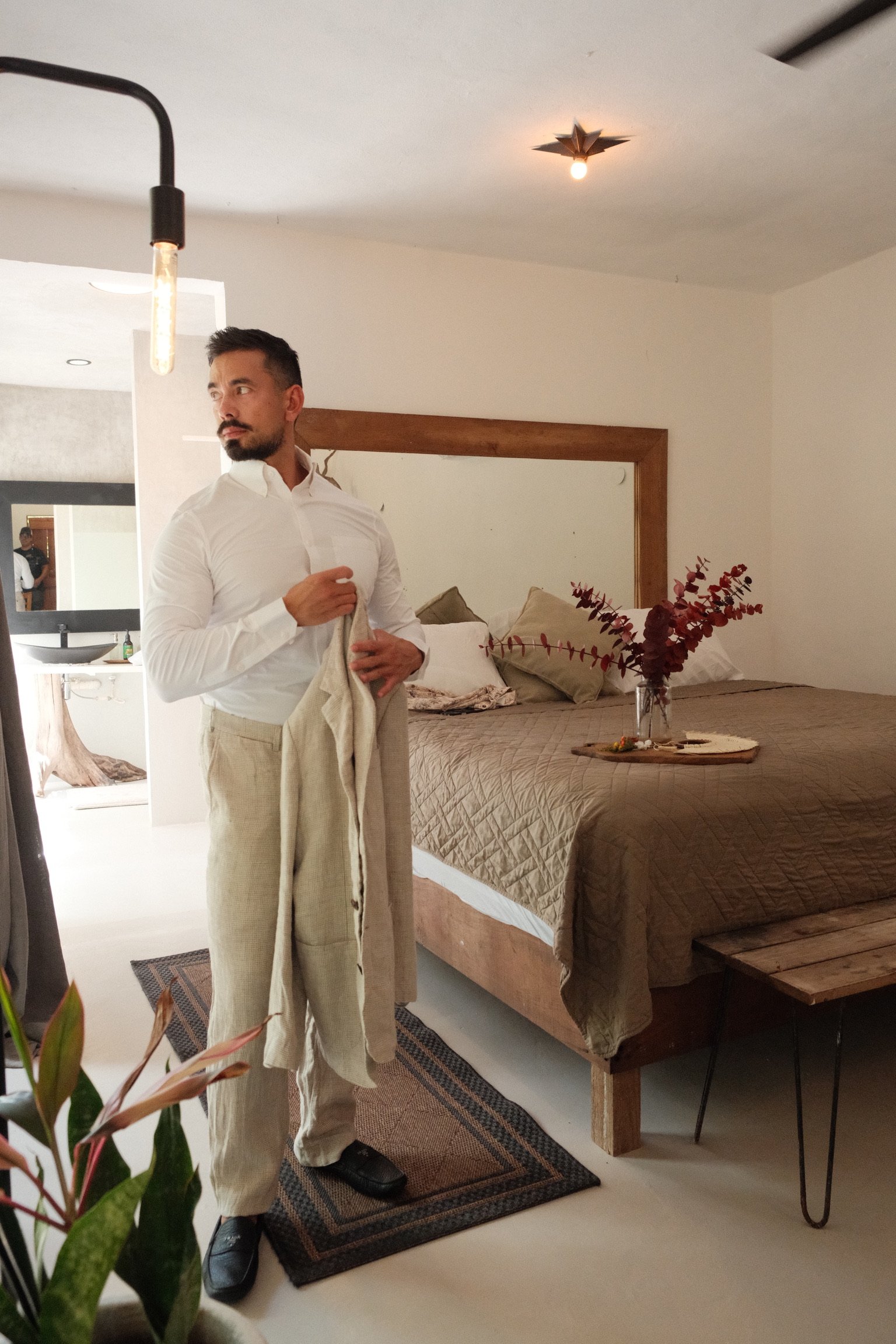 Groom getting ready in his room at Rancho Verde