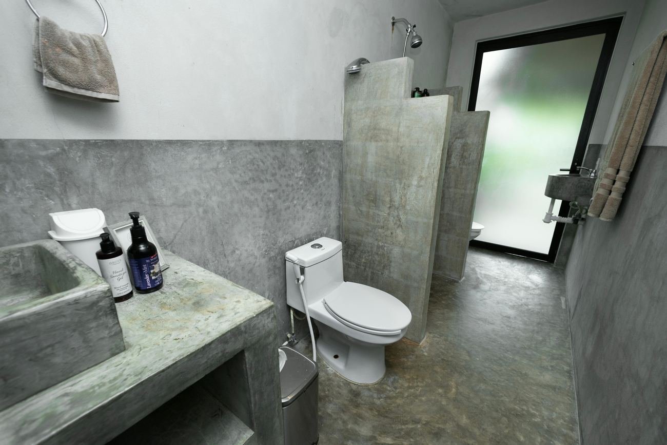 Finished concrete bathroom with shower at Rancho Verde Tulum