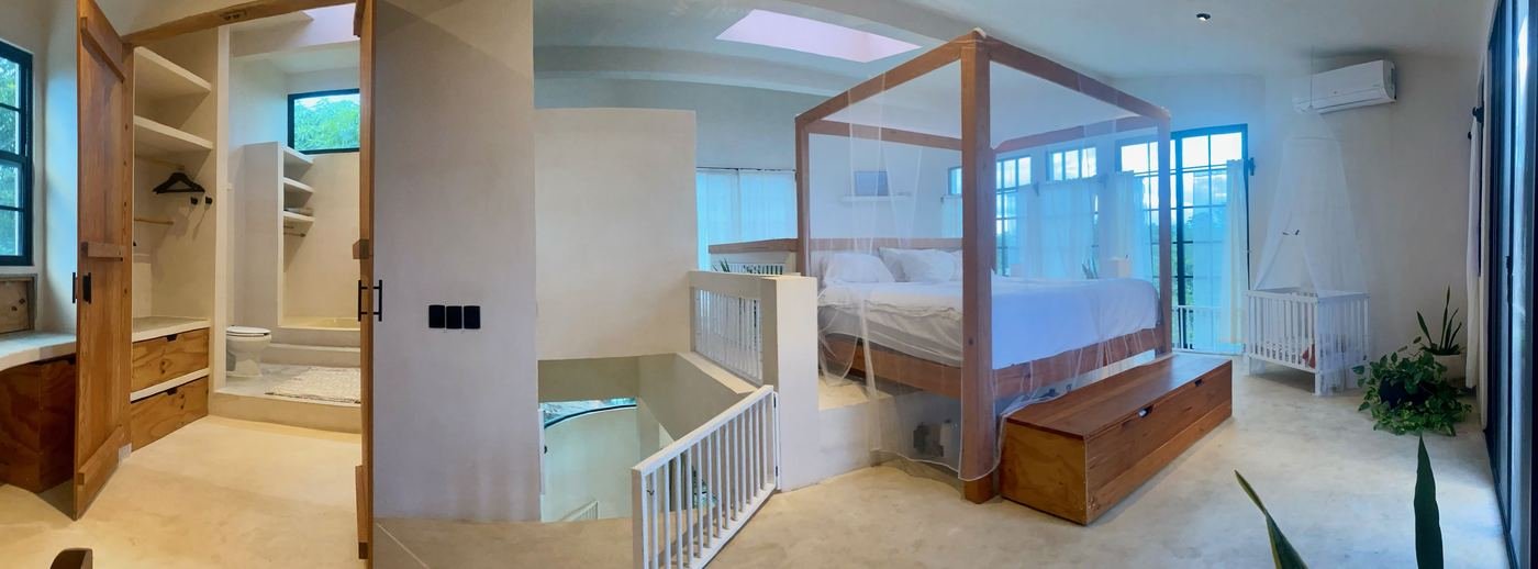 Bedroom loft with canopy bed at Rancho Verde Tulum