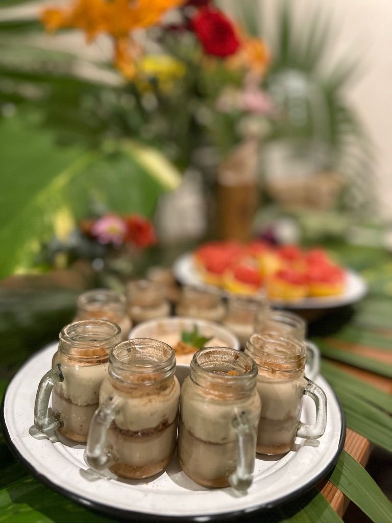 Chocolate dessert jars on an enamel plate at Rancho Verde Tulum