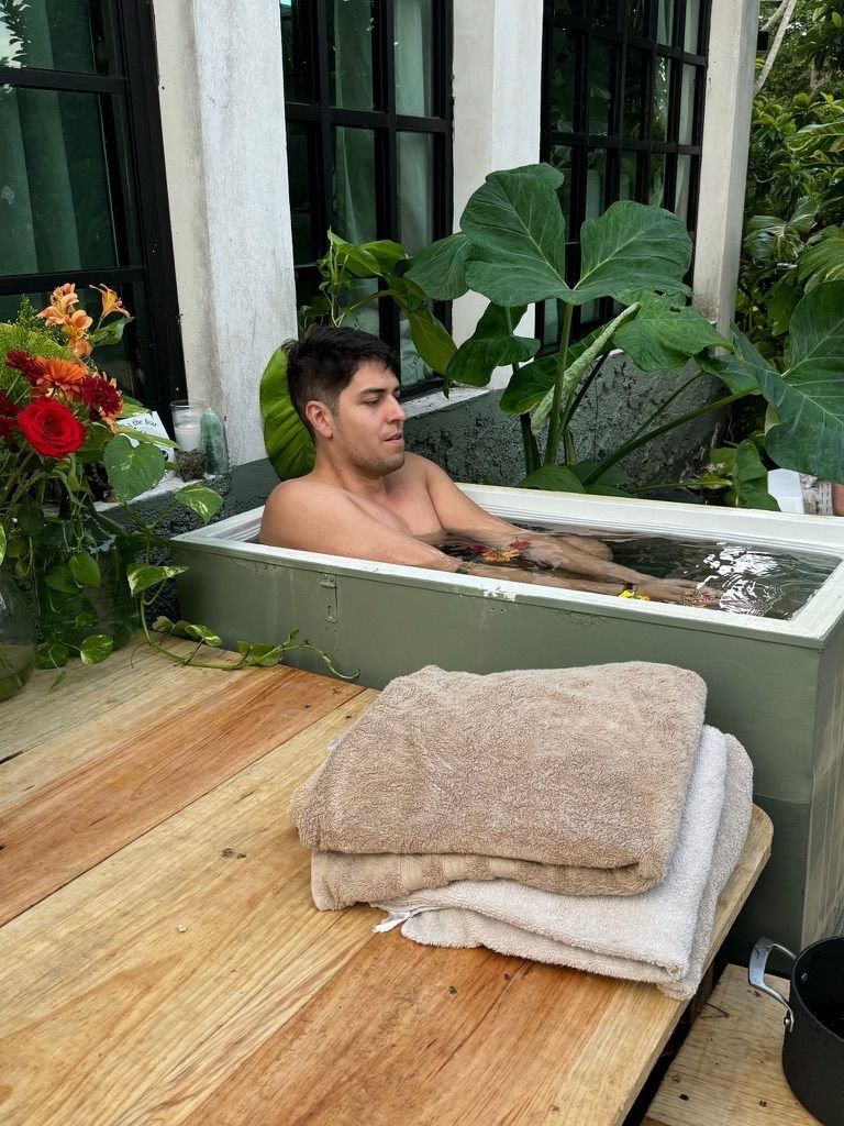 Outdoor bath with folded towels at Rancho Verde Tulum